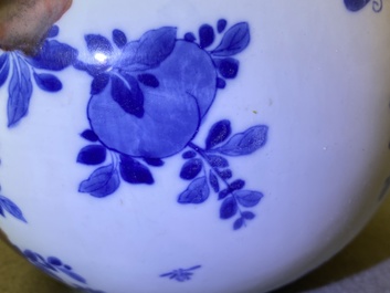 A Chinese blue, white and copper-red 'peaches' bottle vase with inscription, Kangxi