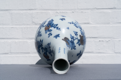 A Chinese blue, white and copper-red 'peaches' bottle vase with inscription, Kangxi
