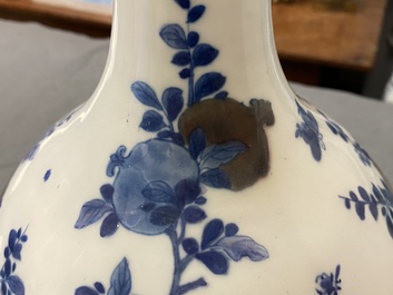 A Chinese blue, white and copper-red 'peaches' bottle vase with inscription, Kangxi