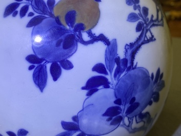 A Chinese blue, white and copper-red 'peaches' bottle vase with inscription, Kangxi
