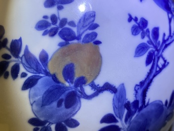 A Chinese blue, white and copper-red 'peaches' bottle vase with inscription, Kangxi