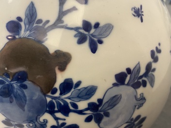 A Chinese blue, white and copper-red 'peaches' bottle vase with inscription, Kangxi