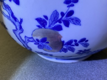 A Chinese blue, white and copper-red 'peaches' bottle vase with inscription, Kangxi