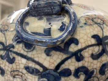 A pair of Chinese blue, white and copper-red meiping crackle-glazed vases, 19th C.