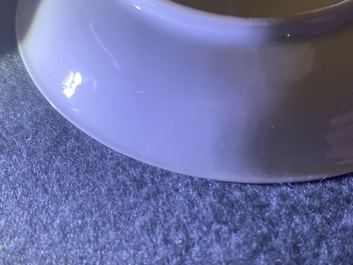 Une tasse et soucoupe en porcelaine de Chine grisaille &agrave; d&eacute;cor d'Europ&eacute;ens, Yongzheng