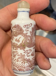 Five Chinese blue and white, iron- and copper-red snuff bottles, 19th C.