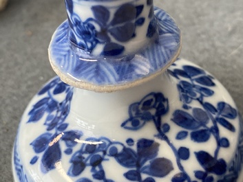 A pair of small Chinese blue and white candlesticks and three vases, Kangxi