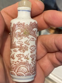 Five Chinese blue and white, iron- and copper-red snuff bottles, 19th C.