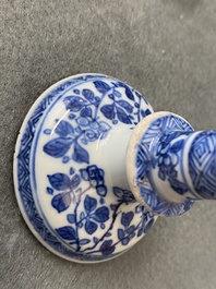 A pair of small Chinese blue and white candlesticks and three vases, Kangxi