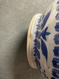 A Chinese blue and white bottle vase with figural medallions, Transitional period
