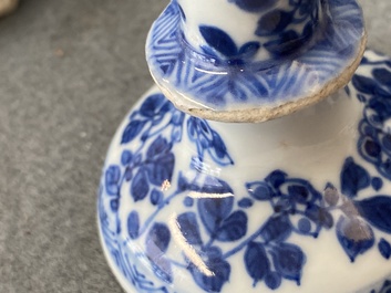A pair of small Chinese blue and white candlesticks and three vases, Kangxi