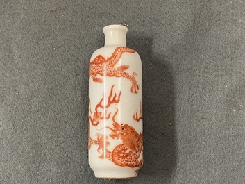 Five Chinese blue and white, iron- and copper-red snuff bottles, 19th C.