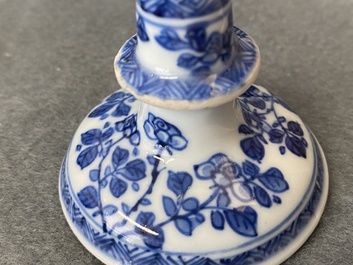 A pair of small Chinese blue and white candlesticks and three vases, Kangxi