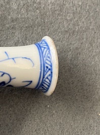 A pair of small Chinese blue and white candlesticks and three vases, Kangxi