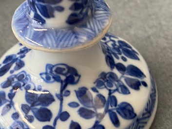 A pair of small Chinese blue and white candlesticks and three vases, Kangxi