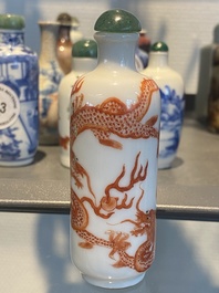 Five Chinese blue and white, iron- and copper-red snuff bottles, 19th C.