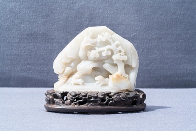 A Chinese celadon jade 'mountain landscape' boulder, 19/20th C.