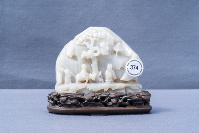 A Chinese celadon jade 'mountain landscape' boulder, 19/20th C.