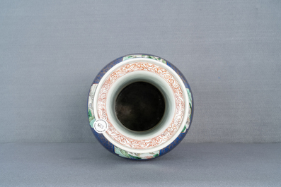 A massive Chinese famille verte on powder blue-ground rouleau vase, Kangxi