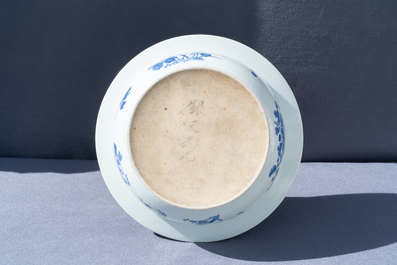 A Chinese blue and white basin with floral design, 19th C.