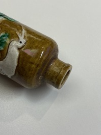 Twelve Chinese monochrome and sancai-glazed snuff bottles, 19/20th C.