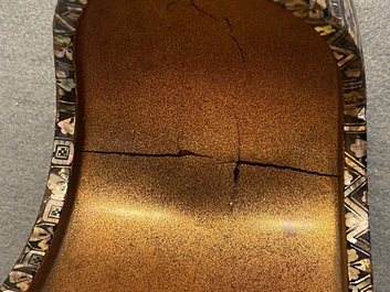 A Japanese aogai-nashiji 'kura' saddle with associated 'abumi' stirrups, Muromachi, 16th C.
