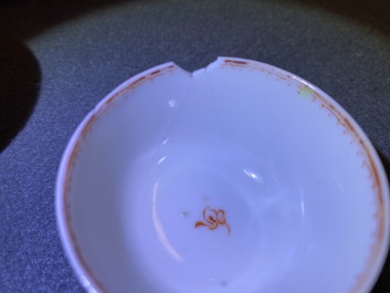 Seven Chinese famille rose 'Mandarin' cups and saucers, Qianlong