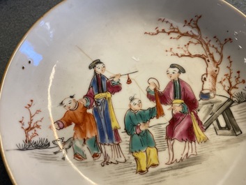 Thirteen Chinese famille rose cups and eleven saucers with mandarin design, Qianlong
