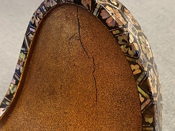 A Japanese aogai-nashiji 'kura' saddle with associated 'abumi' stirrups, Muromachi, 16th C.