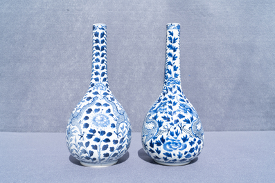A pair of Chinese blue and white bottle vases with dragons, 19th C.