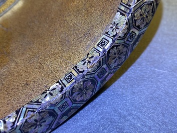A Japanese aogai-nashiji 'kura' saddle with associated 'abumi' stirrups, Muromachi, 16th C.