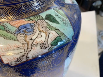 A massive Chinese famille verte on powder blue-ground rouleau vase, Kangxi
