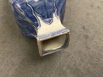 A pair of square Chinese blue and white covered vases and a tea caddy, Kangxi