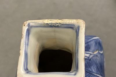 A pair of square Chinese blue and white covered vases and a tea caddy, Kangxi