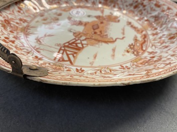 Three Chinese iron-red and gilt plates and a silver-mounted dish, Kangxi