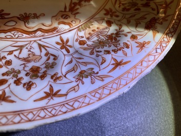 Three Chinese iron-red and gilt plates and a silver-mounted dish, Kangxi
