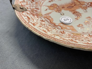 Three Chinese iron-red and gilt plates and a silver-mounted dish, Kangxi