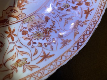 Three Chinese iron-red and gilt plates and a silver-mounted dish, Kangxi