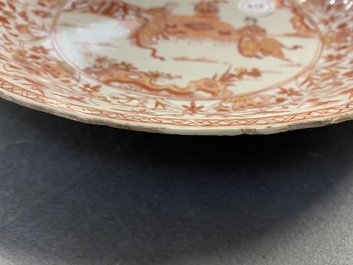 Three Chinese iron-red and gilt plates and a silver-mounted dish, Kangxi