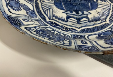 A Chinese blue and white kraak porcelain charger, a vase, a crow cup and a small plate, Wanli