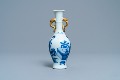 A Chinese blue and white vase with gilt elephant-head handles, Kangxi