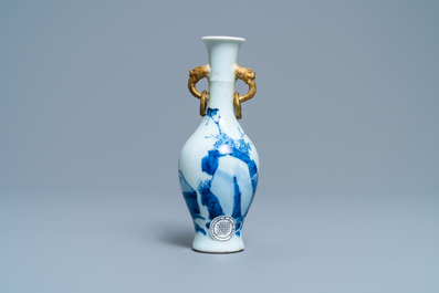 A Chinese blue and white vase with gilt elephant-head handles, Kangxi