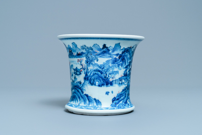 A fine Chinese blue, white and copper red 'Master of the Rocks' brush pot, Kangxi