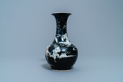 A Chinese black-ground grisaille and iron red vase and a snuff bottle, 18th C.