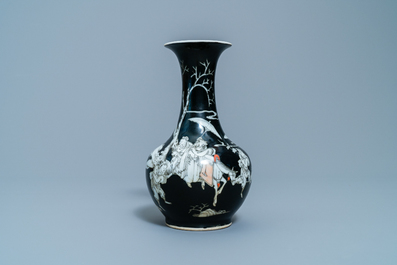 A Chinese black-ground grisaille and iron red vase and a snuff bottle, 18th C.