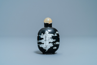A Chinese black-ground grisaille and iron red vase and a snuff bottle, 18th C.