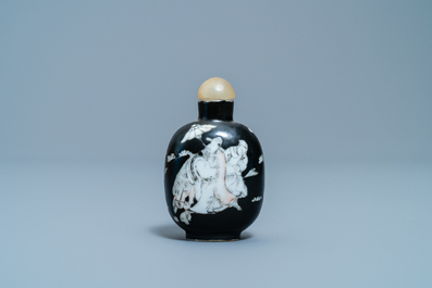 A Chinese black-ground grisaille and iron red vase and a snuff bottle, 18th C.