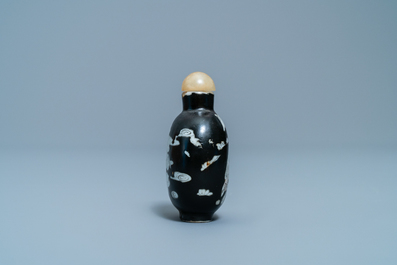 A Chinese black-ground grisaille and iron red vase and a snuff bottle, 18th C.