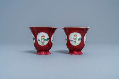 A pair of Chinese famille rose ruby-ground wine cups with foreigners, Qianlong