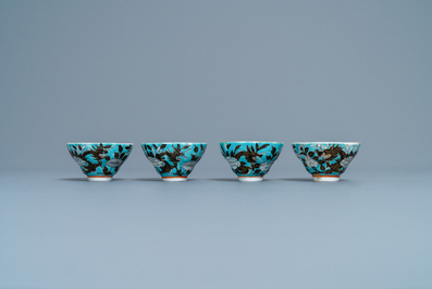 Four Chinese blue-ground Dayazhai-style 'dragon' cups and saucers, 19th C.